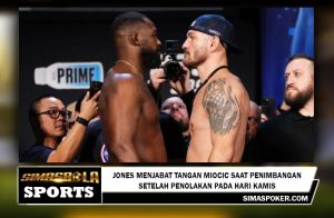 Jones menjabat tangan Miocic saat penimbangan setelah penolakan pada hari Kamis